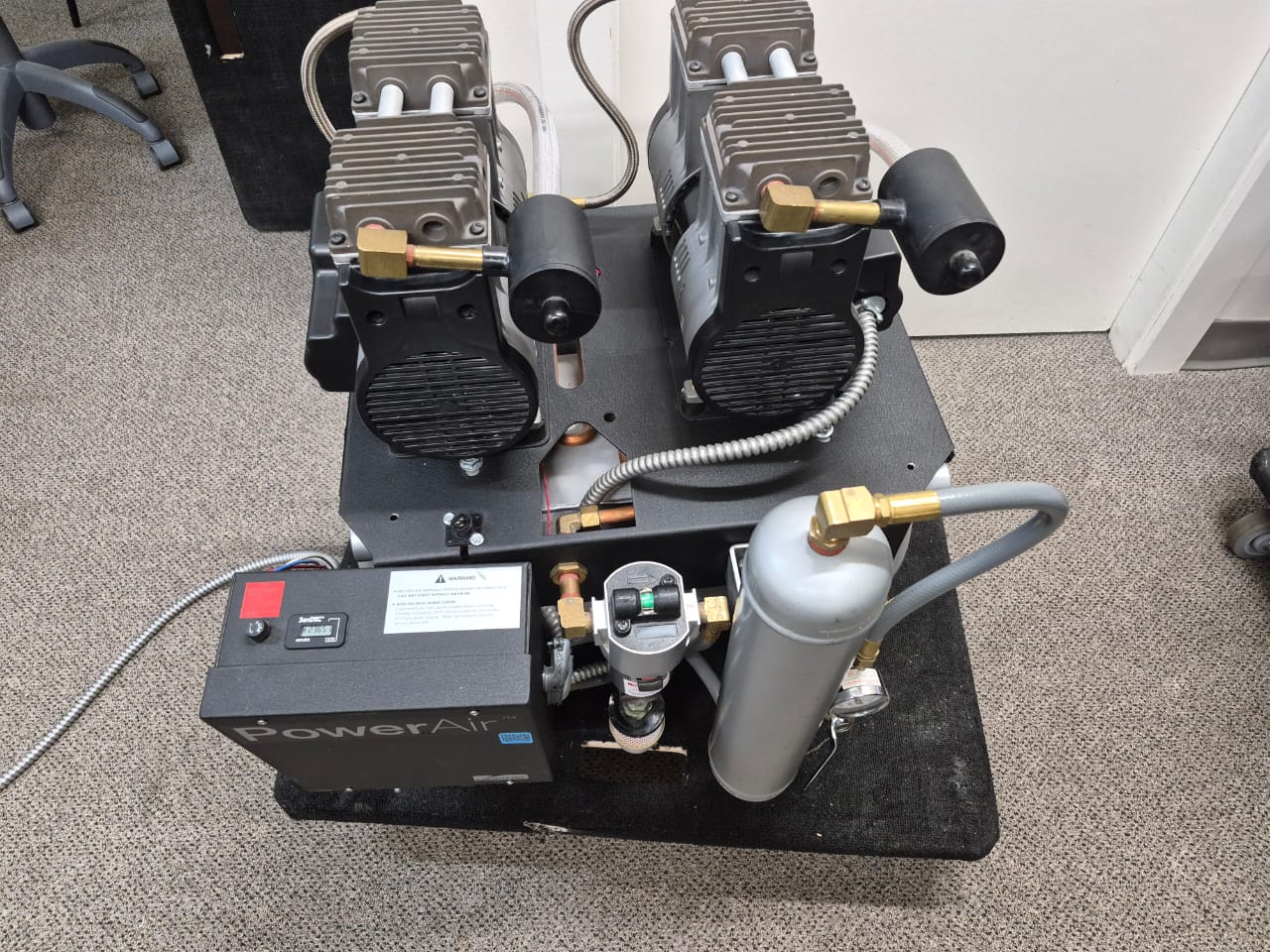 Pre-owned Midmark PowerAir P52 dental air compressor front view